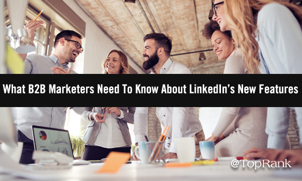 Group of B2B marketers around a table planning uses for new LinkedIn features image.
