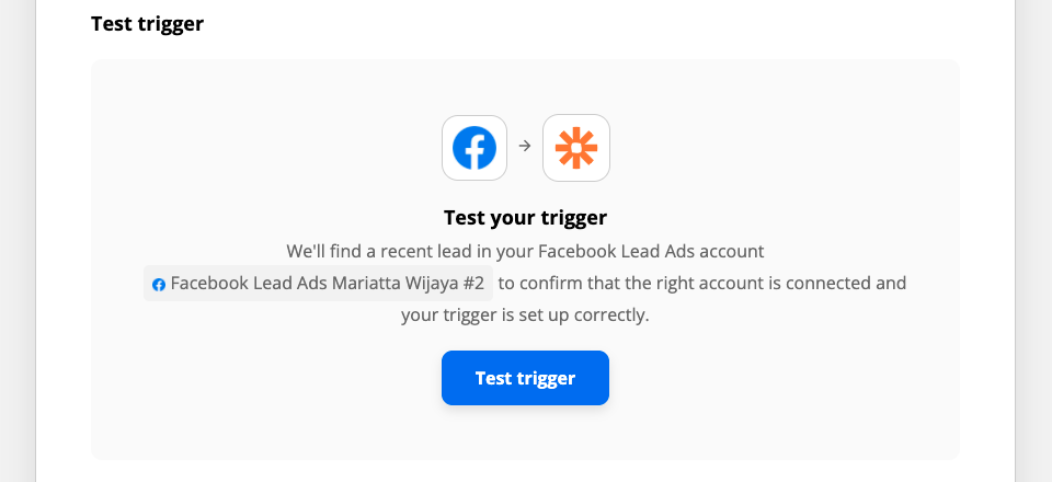 The blue Facebook app logo with an arrow pointing to the orange Zapier logo above the test "Test your trigger".