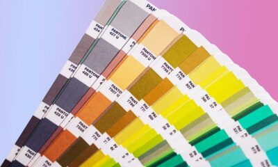 An array of Pantone color swatches against an ombre background